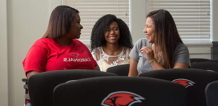 three students chatting