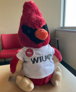 image of a stuffed cardinal plush sitting on a desk